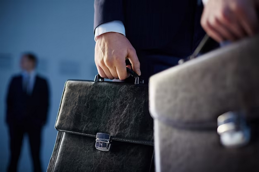 Men in suits carrying leather briefcases